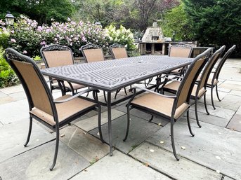 A Cast Aluminum And Mesh Dining Table And Set Of 8 Chairs By Cast Classics