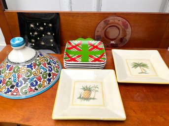 A Colorful Assortment Of Plates And A Tagine Lid