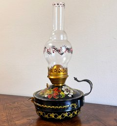 A Vintage Tole Ware Hurricane Lamp