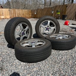 A Set Of 4 Saab Rims With Tires