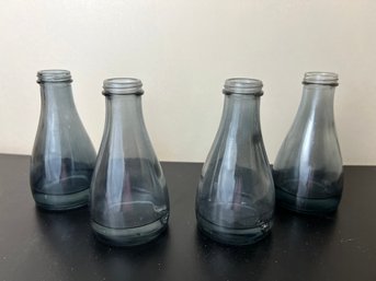 Set Of Four Vintage Petite Smoked Glass Bottles