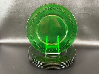 A Set Of Six Service Plates In Green Glass