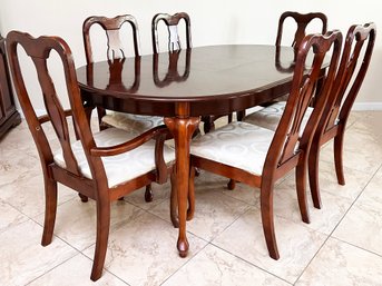 A Cherry Wood Extendable Dining Table And Set Of 6 Chairs