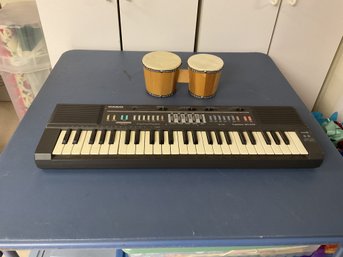Casio Keyboard And Bongos