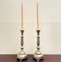 A Pair Of Antique Brass Candlesticks