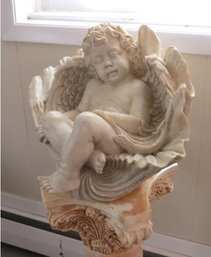 Plastic Garden Statue Of A Cherub Sleeping In A Giant Clam Shell