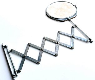 A Vintage Retractable Shaving Mirror