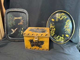 A PAINTED TOLEWARE BOX AND TWO TRAYS