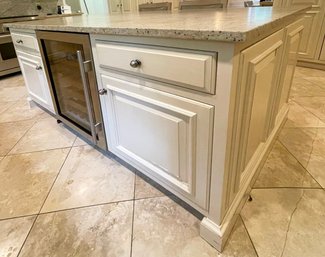 A Kitchen Island With Honed Granite Top