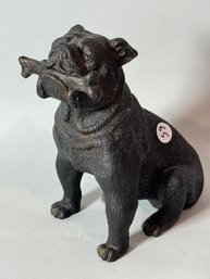 A CAST IRON BULLDOG W/ BONE