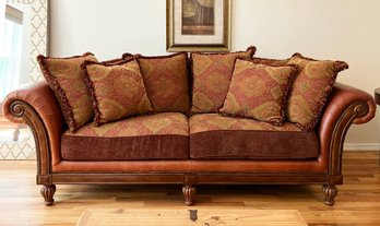 A Rolled Arm Leather And Tapestry Sofa With Nailhead Trim By Broyhill Furniture
