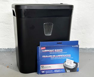 A Paper Shredder And Lubricant Sheets For Maintenance