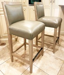 A Pair Of Oak And Leather Counter Stools