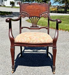 A Mid-19th Century Carved And Scrolled Mahogany Arm Chair