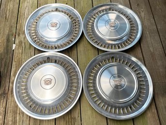 A Set Of 4 Vintage Cadillac Hubcaps