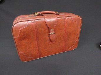 A Vintage Brown Leather Suitcase