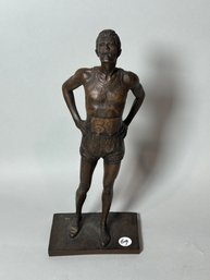 A COMPOSITE STATUE OF A RUNNER SIGNED PARKS