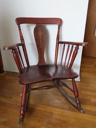 An Armed Rocking Chair With Inlaid Design