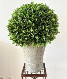 A Faux Boxwood In Cast Stone Planter