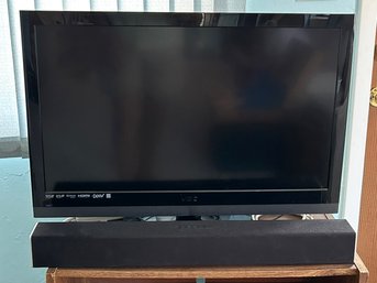 A Sony Vizio 32' Flat Screen TV And Sound Bar