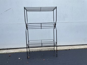 Black Metal Wire Bookshelf With Gilt Medallion Decoration