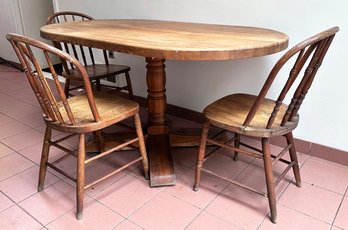 A Vintage Oak Spindle Based Dining Table And Three Chairs