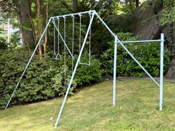 A Vintage Metal Swingset And Climbing Bars