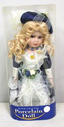 Hand Crafted Porcelain Doll In Plastic