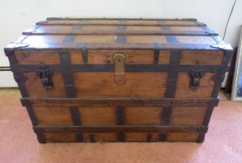 A Flat Top Steamer Trunk By The Sampler Trunk Co., New York