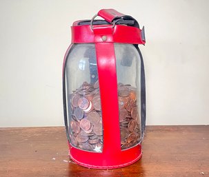 A Jar Of Pennies With Leather Holder!