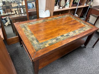 Coffee Table With Nice Slate Trim On Wheels