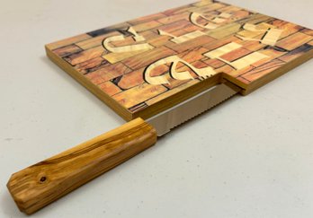 A Challah Knife And Cutting Board