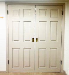 A Pair Of Solid Wood Paneled Doors - Laundry Room