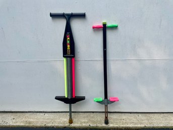 Two 1980s Neon Decorated Pogo Sticks