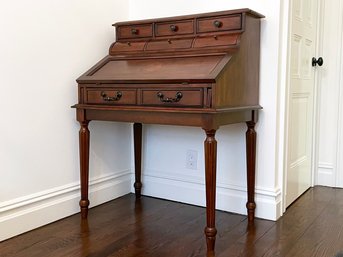 A Louis XVI Style Secretary Desk With Inlaid Marquetry Details