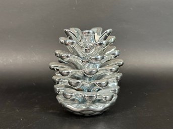 A Stylish Silver Pinecone Candle Holder