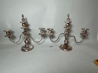 A PAIR OF SILVERPLATED CANDELABRA