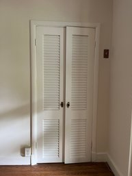 A Group Of Louvered Doors