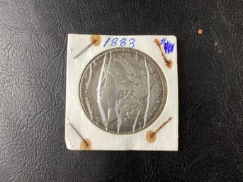 1883 US Morgan Silver Dollar (toned) 90 Per Cent Silver)
