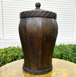 A Lidded Wicker Wastebasket