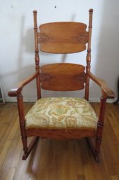 A Spring Seat Panel Back Rocking Chair