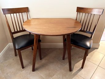 A Vintage Mahogany Drop Leaf Kitchen Table And Pair Of Spindle Back Chairs