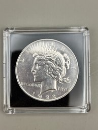 1922 AU Condition Silver Peace Dollar In Plastic Case