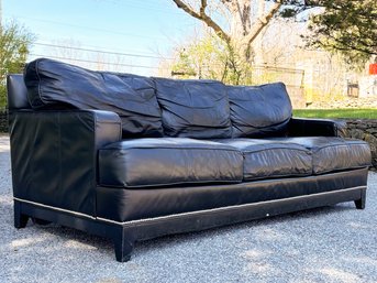 An Elegant Sofa In Black Leather With Nailhead Trim By Restoration Hardware