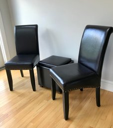 Pair Of Faux Leather Chairs With Nail Head Trim And Ottoman