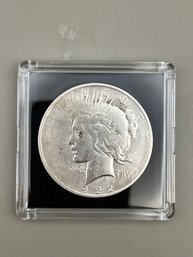 1922-D Silver Peace Dollar In Plastic Case