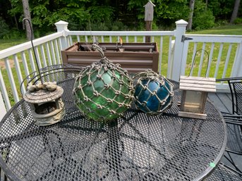 TWO GLASS BUOYS AND TWO BIRD HOUSES