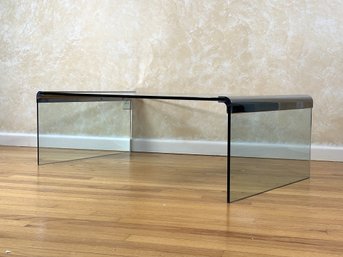 A Vintage Modern Waterfall Coffee Table In Smoked Glass With Rounded Chrome Corners