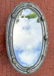 An Embossed Tin Mirror