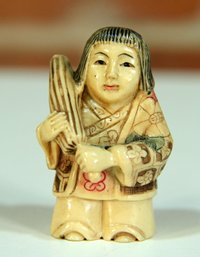 Vintage Carved Netsuke Of A Girl Carrying An Umbrella